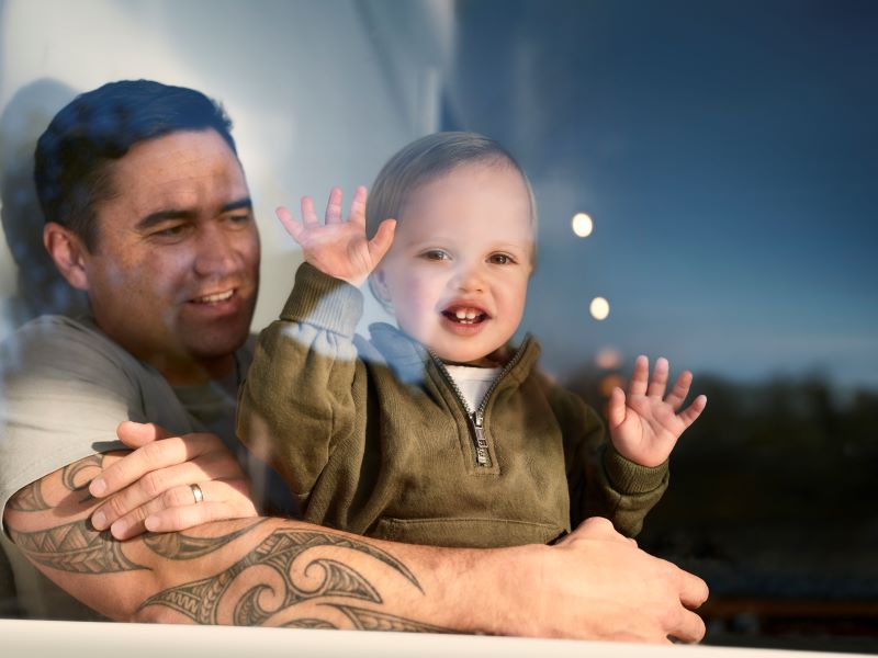 Father and child at window 800x600