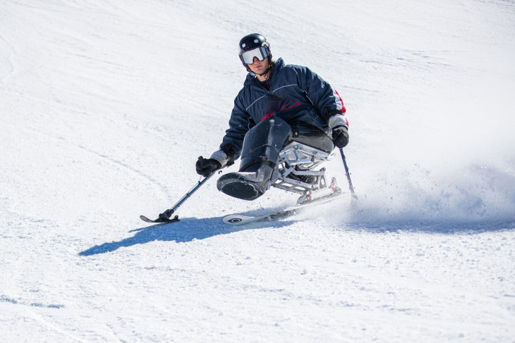Aaron Ewen skis down a snowy slope