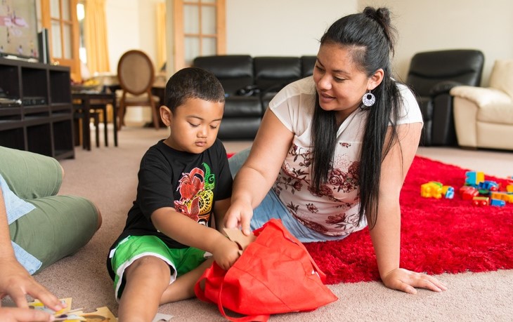 Pacifica woman playing with child