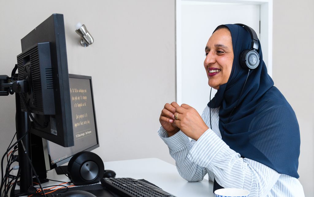 Woman sitting at a desk using computer