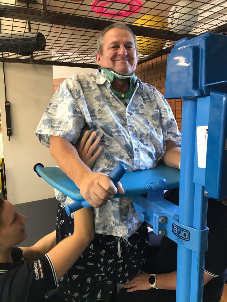 George Thompson on an exercise machine in the spinal unit during his rehabilitation.