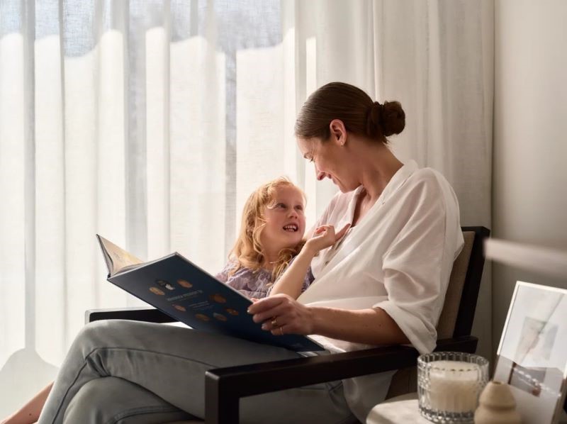 Mother and child with book