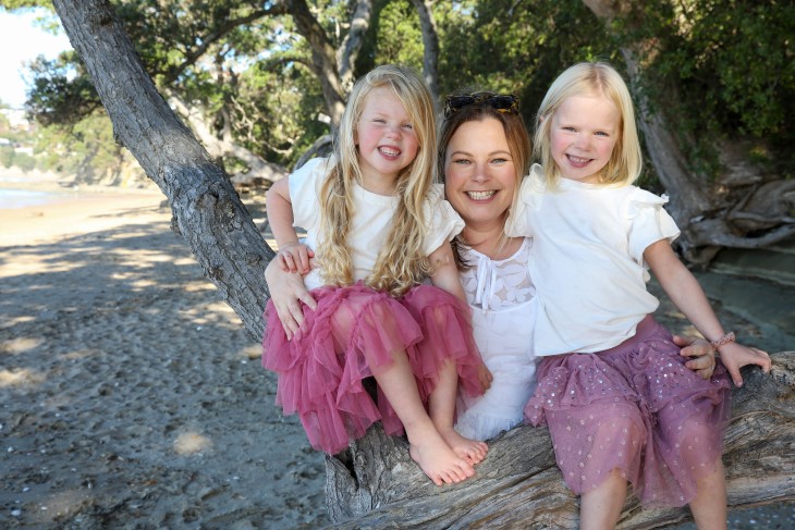 Trudy poses with her two young children