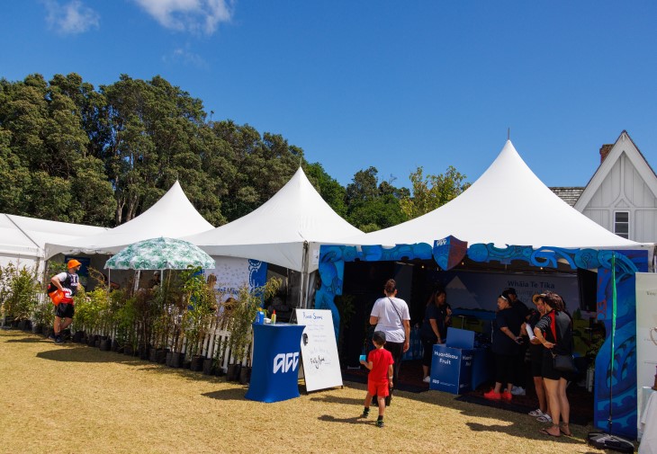 Several people in and around the ACC tent at Te Matatini.