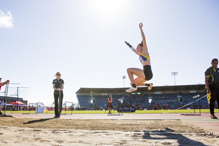 Anna Grimaldi jumping through the air during a long-jump competition. 