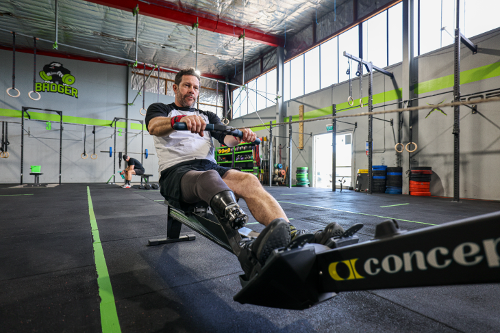 Craig Harrington working out on a rowing machine. 