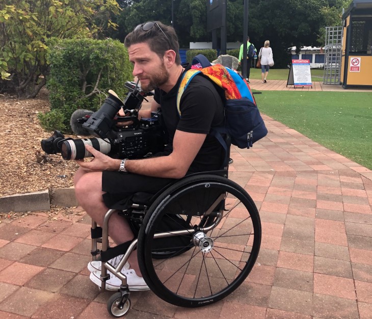 Dan Buckingham with a camera doing some filming on location.