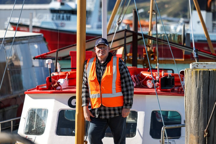 Former fisherman and MarineSAFE founder Darren Guard standing on a fishing boat. 