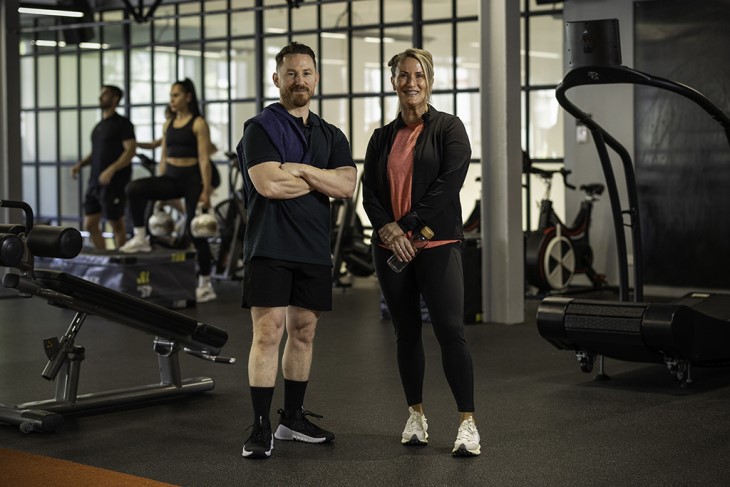 Registered personal trainers and gym directors Carl Hammington and Mish McCormack standing together.