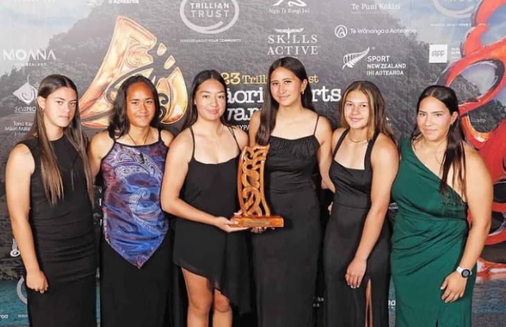 Hine Brooking posing with other members of the New Zealand junior 16 women's waka ama team at the Māori Sports Awards.