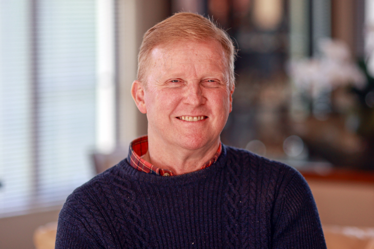 A head and shoulders photo of a smiling Jason Ross.