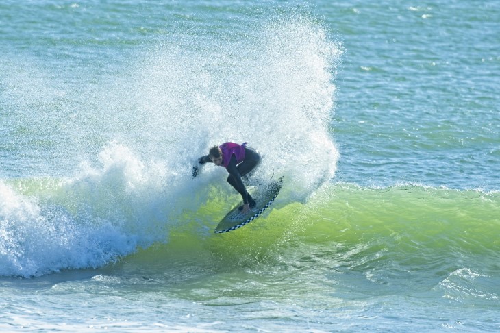 Jay Piper-Healion surfing on a wave.