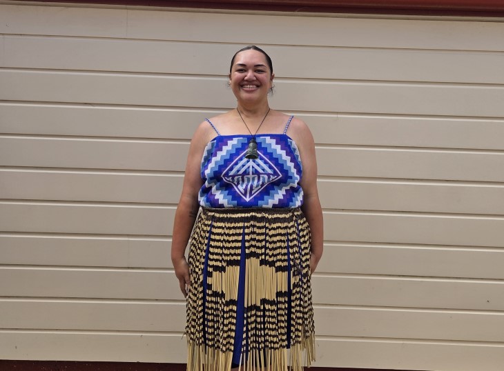 A close-up photo of a smiling Karalee Whiu wearing her traditional Māori clothing.