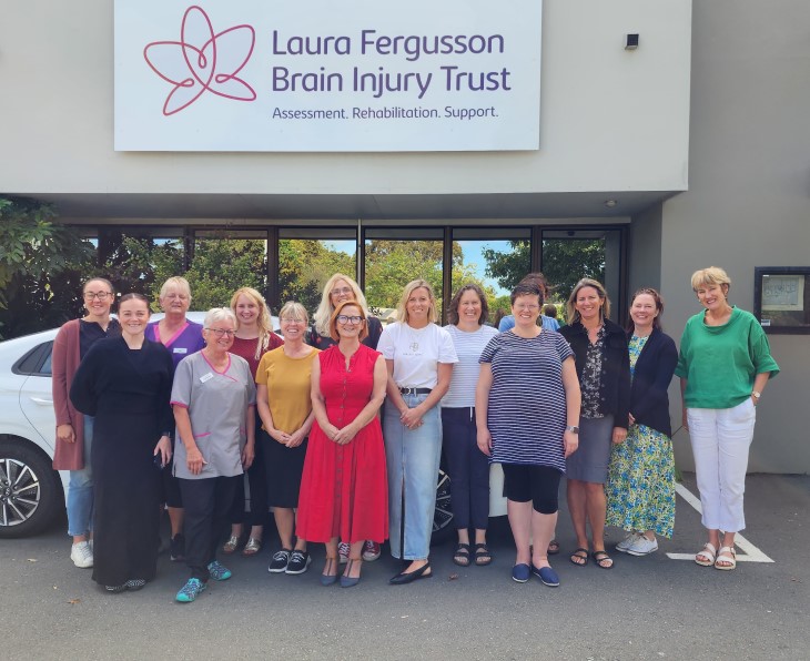 A team photo of staff members from the Laura Fergusson Brain Injury Trust. 