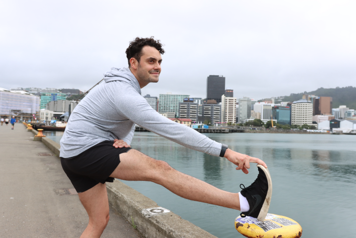 Liam Olson having a stretch on Wellington waterfront. 
