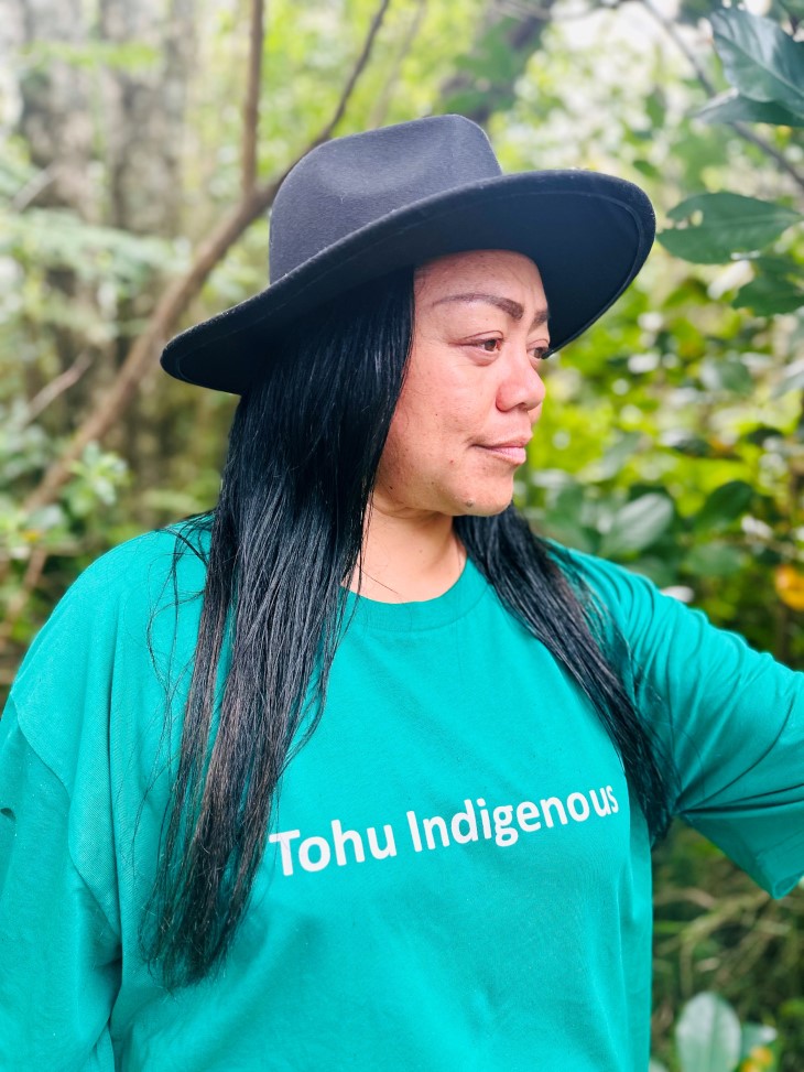 A close-up photo of Nalini Cook in the bush wearing a hat.