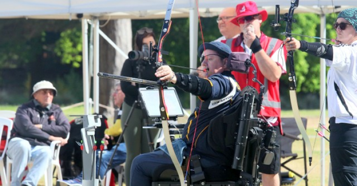 Paul Wallace aiming at the target in his first archery competition.