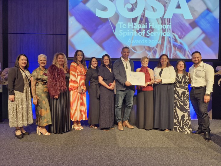 Members of the ACC Māori health team pose with their award at Te Hāpai Hapori, the Spirit of Service