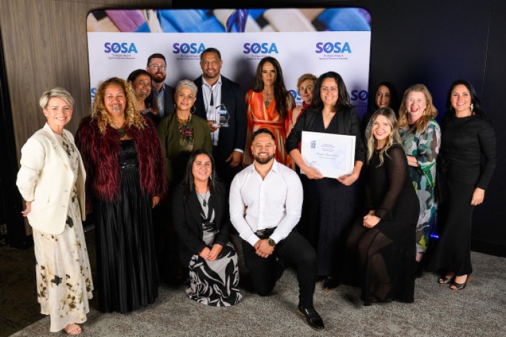 The ACC Māori health whānau pose with their award with representatives from award sponsor DXC Technology.