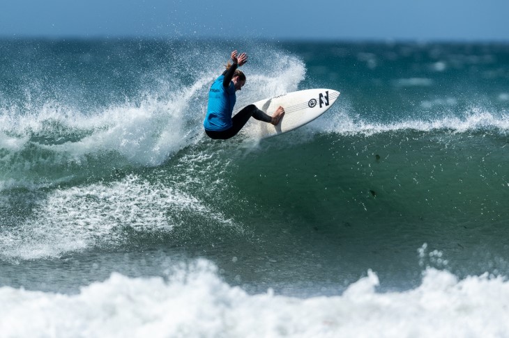 A surfer riding a wave.