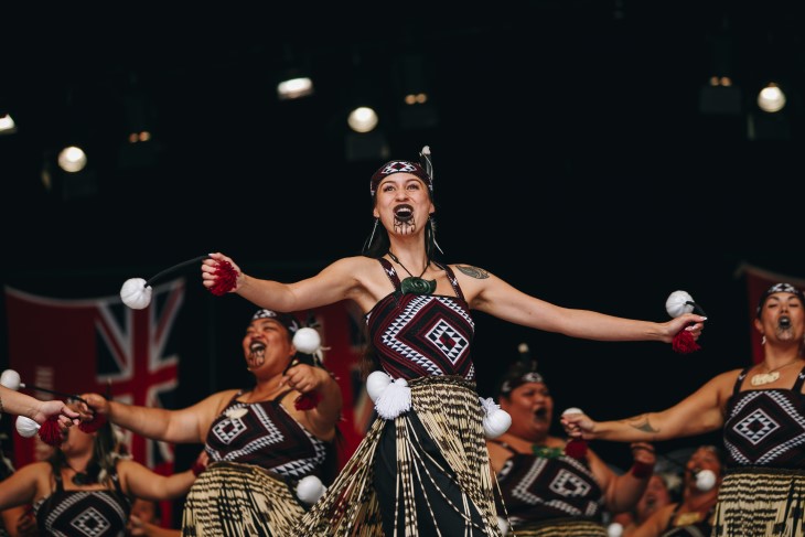 A woman performing at the front of a kapa haka group at Te Matatini.