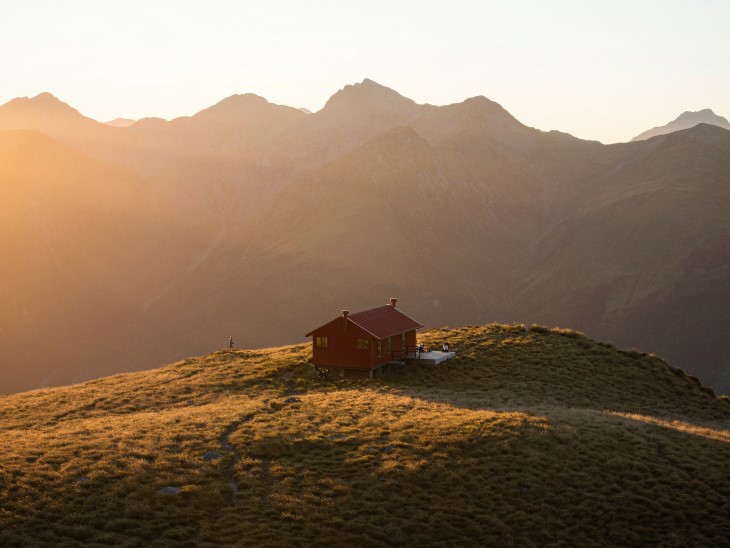 A tramping hut on a mountain range. 